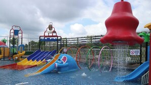 A water park with multiple slides and water features. - Senyum World Hotel (Batu)