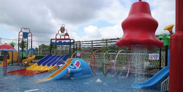 A water park with multiple slides and water features. - Senyum World Hotel (Batu)