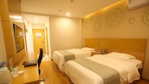 A hotel room with two beds, a desk with a telephone, and a mirror. - Greentree Inn Hefei Huaxia International Chabocheng Branch (Hefei)