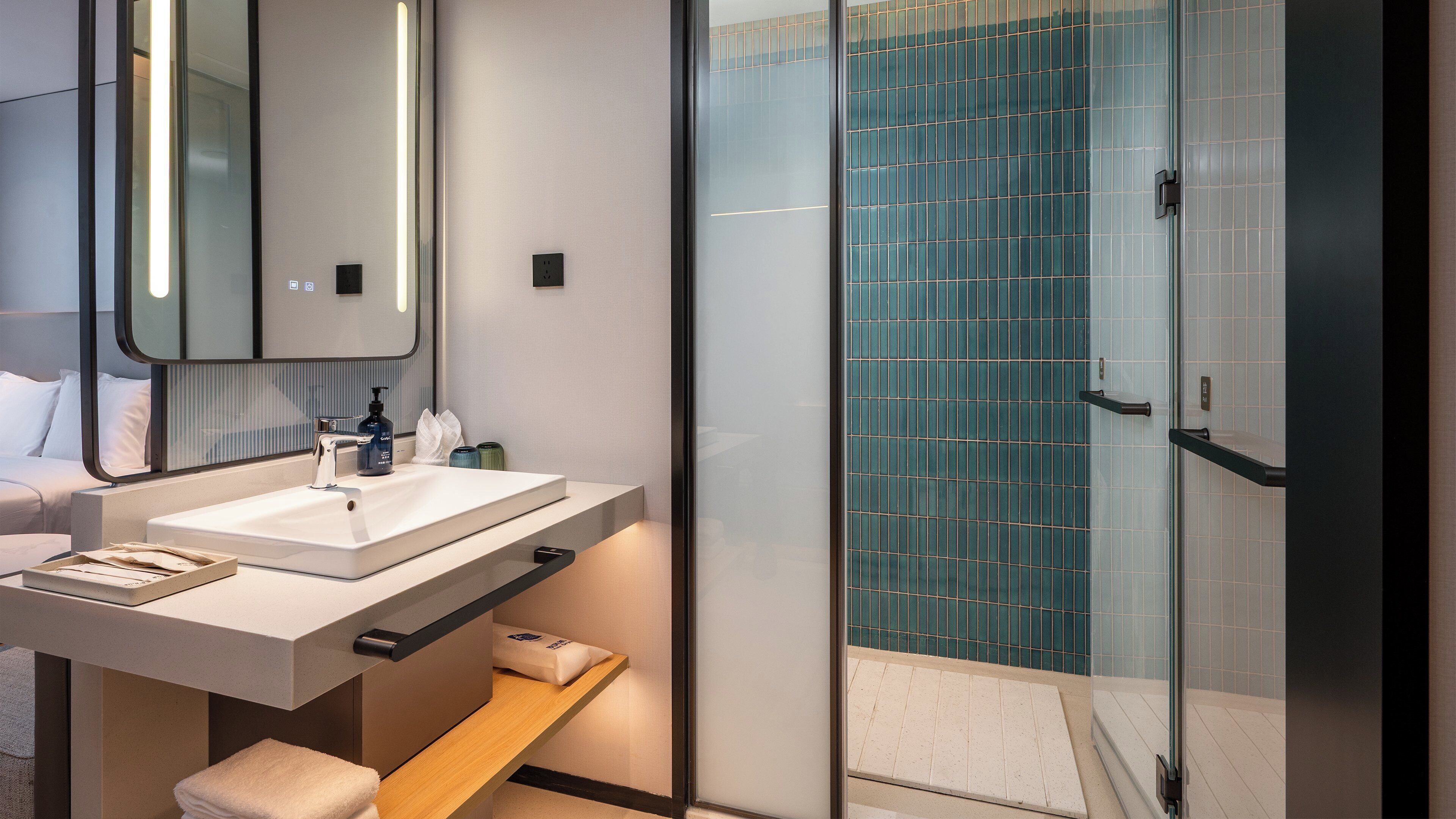 Shower, hair dryer, slippers, towels
