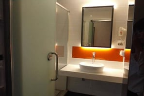 A bathroom with a white sink, a mirror, and a handrail. - 7 Days Premium Shanghai International Automobile City Tongji University Branch (Shanghai)