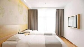 A hotel room with two beds, a flat-screen TV, and a large window with curtains. - Greentree Inn Yingtan Xinjiang New District Munici (Yingtan)