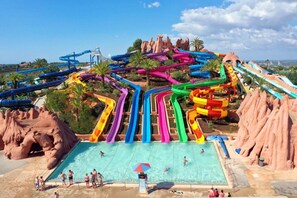 A water park with multiple slides and a pool area. - Tiny Whale Lodge, a unique space for groups (Lagos)