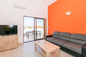 Appartamento (N1) | Area soggiorno | TV a schermo piatto