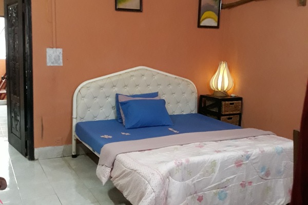 Large and privacy bedroom with air-conditioned and sofas .