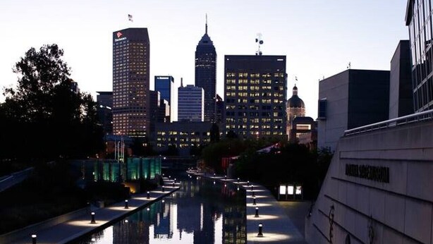 A calm water feature with a cityscape in the background. - 360° TERRACE VIEW KING BEDS SELF CHECK-IN WIFI W/D (Indianapolis)