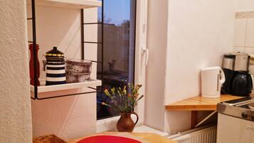 Fridge, stovetop, coffee/tea maker, electric kettle