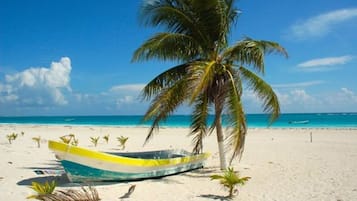 On the beach, sun-loungers