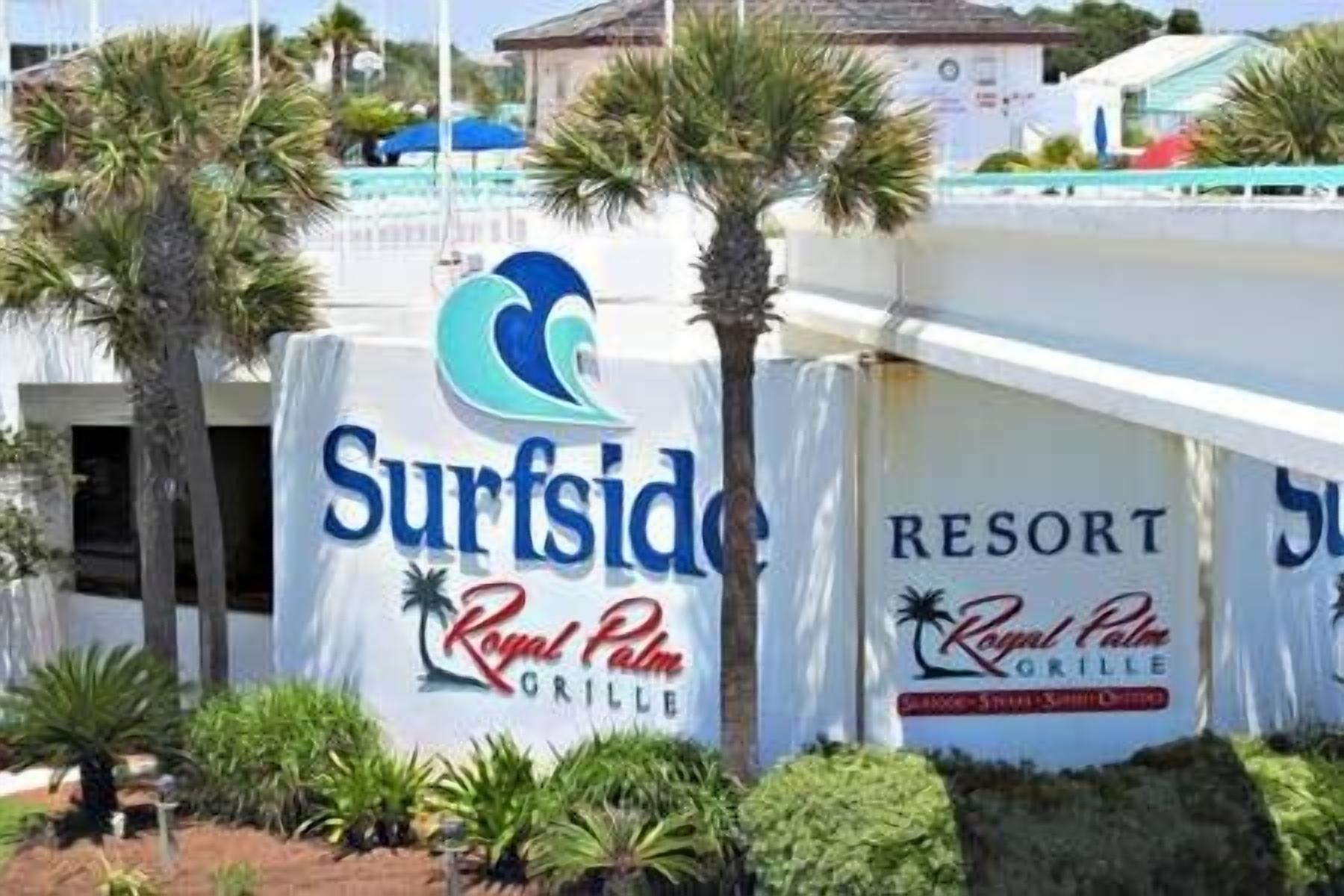 A sign for 'Surfside Resort' with 'Royal Palm Grill' written below.