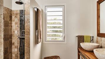 Shower, rainfall showerhead, hair dryer, towels