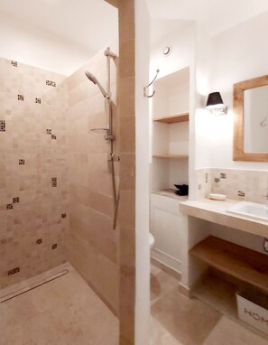 Shower, hair dryer, towels, toilet paper