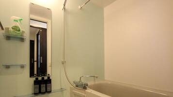 Apartment, 1 Bedroom | Bathroom | Combined shower/tub, deep soaking tub, hair dryer, towels