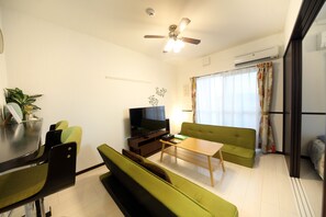 Apartment, 1 Bedroom | Living area | TV