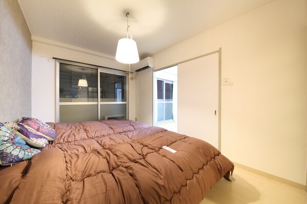 Apartment, 2 Bedrooms | 2 bedrooms, bed sheets - EX Tenjinnomori Apartment 201 (Osaka)