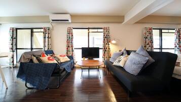 Apartment, 1 Bedroom | Living area | TV