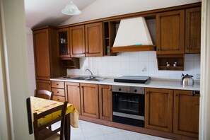 Apartment, 1 Bedroom, Non Smoking | Private kitchen | Full-size fridge, oven, stovetop, cookware/dishes/utensils - Comfortable Apartment - Quartu - close to Poetto Beach (Quartu Sant'Elena)
