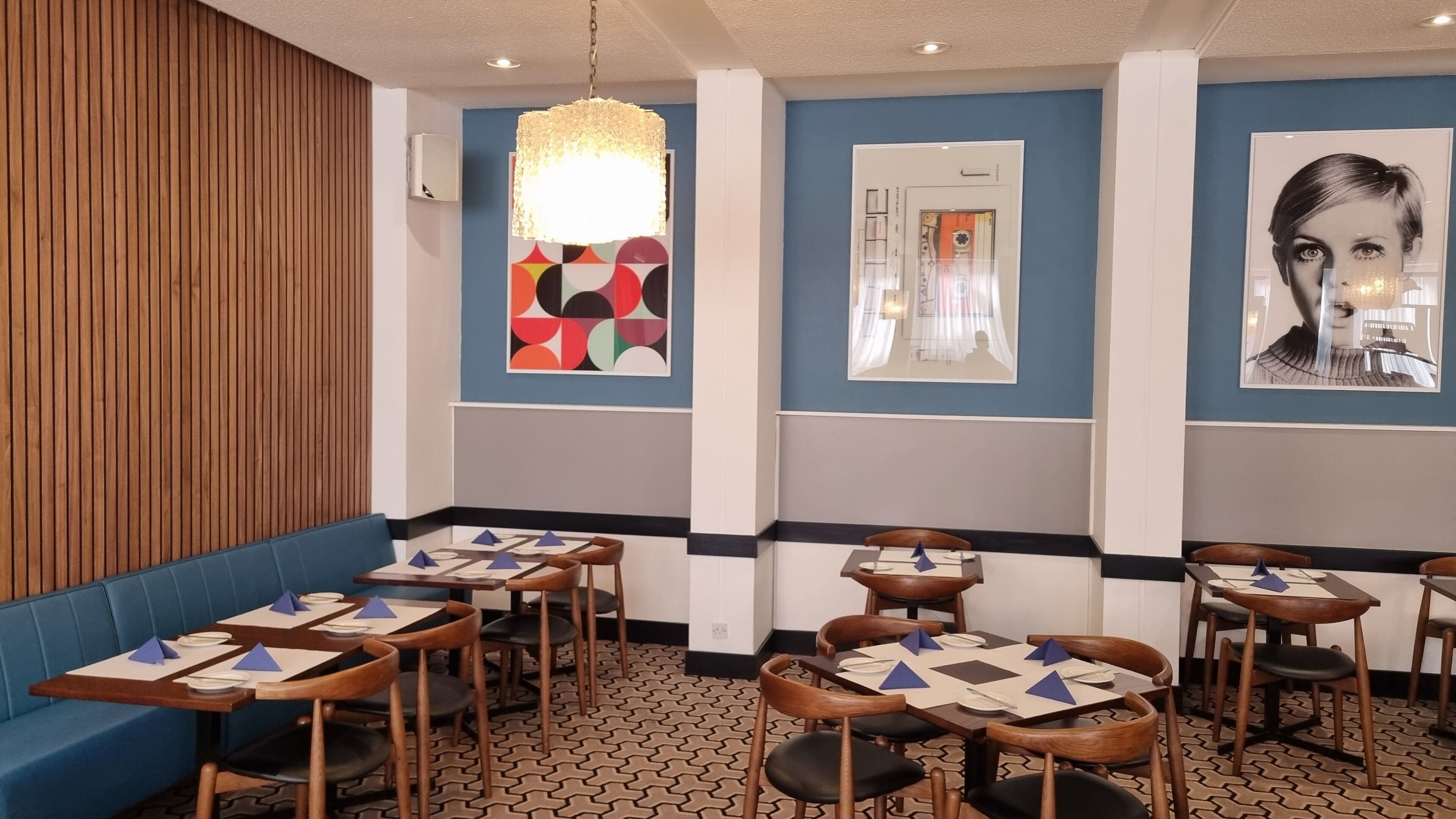 A restaurant interior with booths, tables, and chairs.