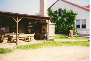Enjoy a meal at this charming outdoor café with open-air seating and a picturesque view.