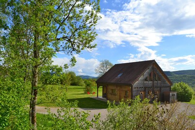 Secluded chalet in the sun with breathtaking views of a wooded valley  