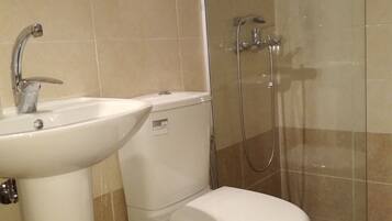 Shower, towels, toilet paper