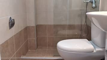 Triple Room, Garden View | Bathroom | Shower, towels, toilet paper