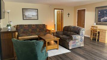 Business Apartment | Living area | 32-inch flat-screen TV with cable channels, TV