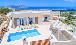 Outdoor pool, a heated pool, pool loungers