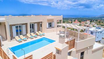 Outdoor pool, a heated pool, sun loungers