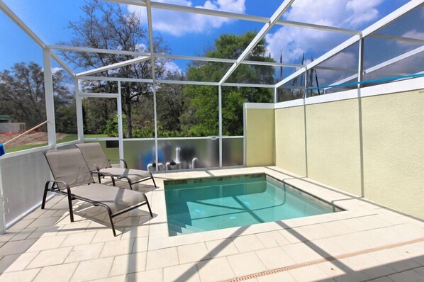 A heated pool, sun loungers