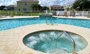 A heated pool, sun loungers