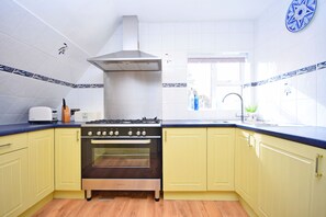 Dishwasher, toaster, cookware/dishes/utensils, dining tables