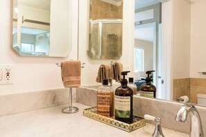 Bathtub, hair dryer, towels, soap