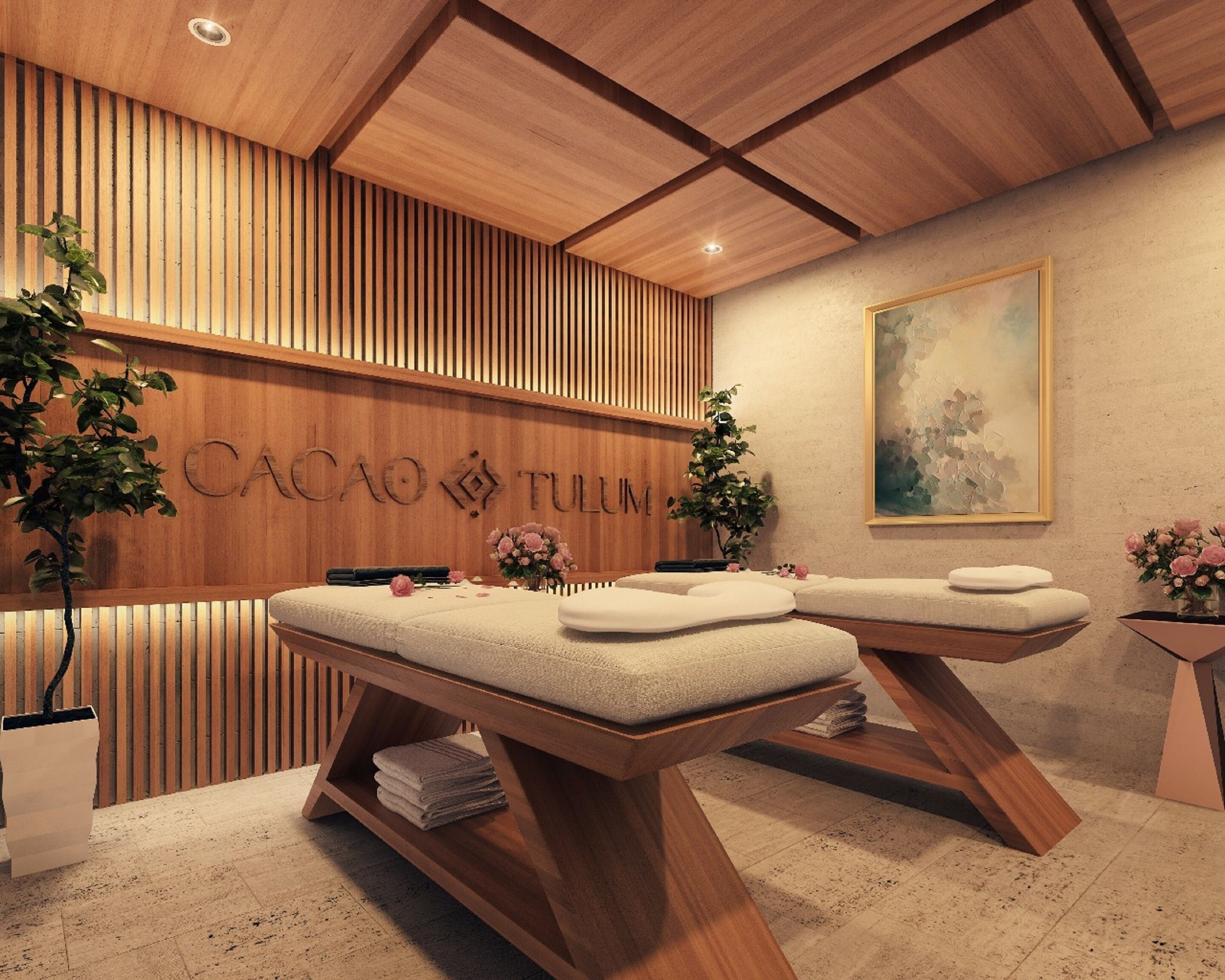 A spa room with wooden paneling, two massage tables, a reception desk, and a painting on the wall.