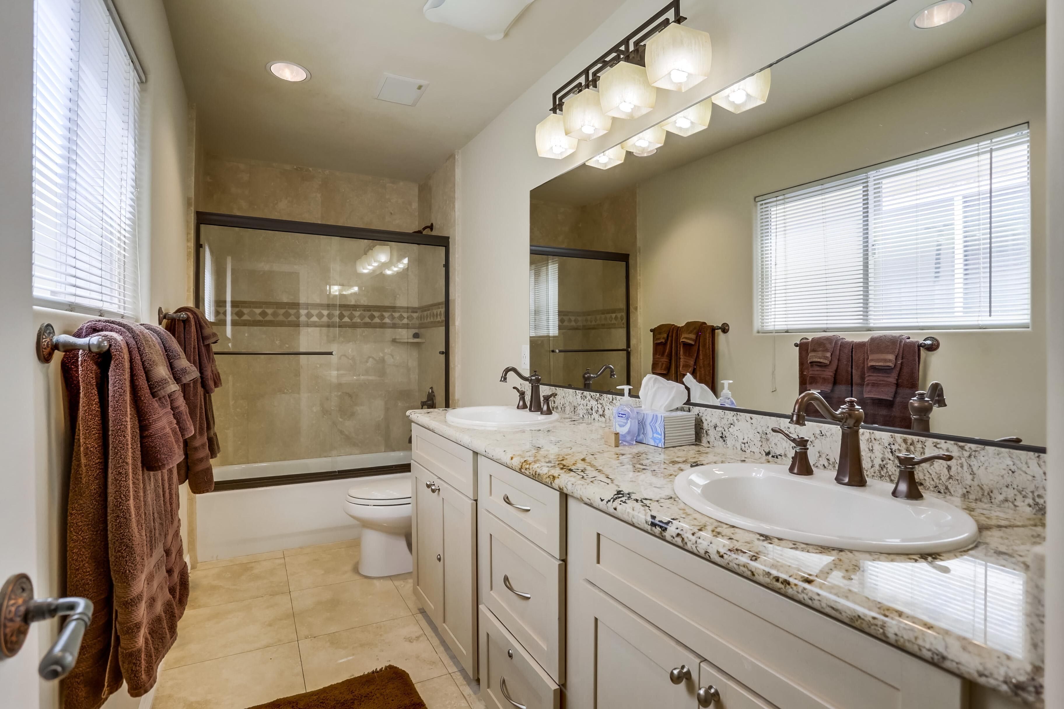 Combined shower/tub, hair dryer, towels, soap