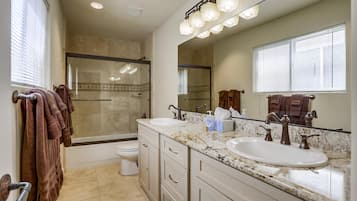 Combined shower/tub, hair dryer, towels, soap