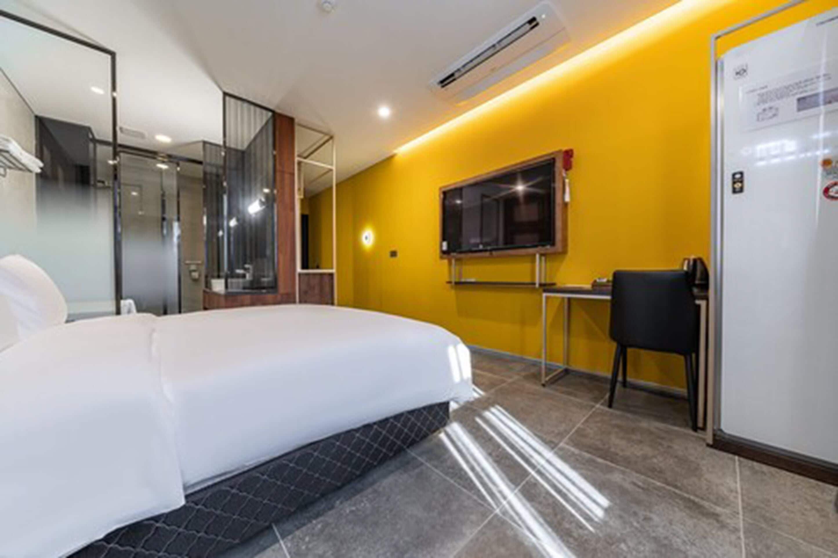 deluxe double room | in-room safe, desk, laptop workspace, blackout curtains