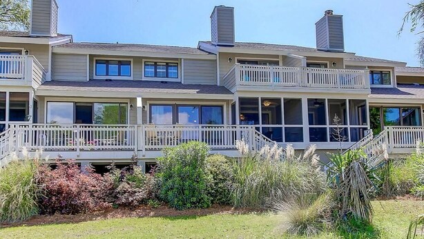 A multi-story house with balconies and large windows. - 50 Fairway Dunes (Isle of Palms)