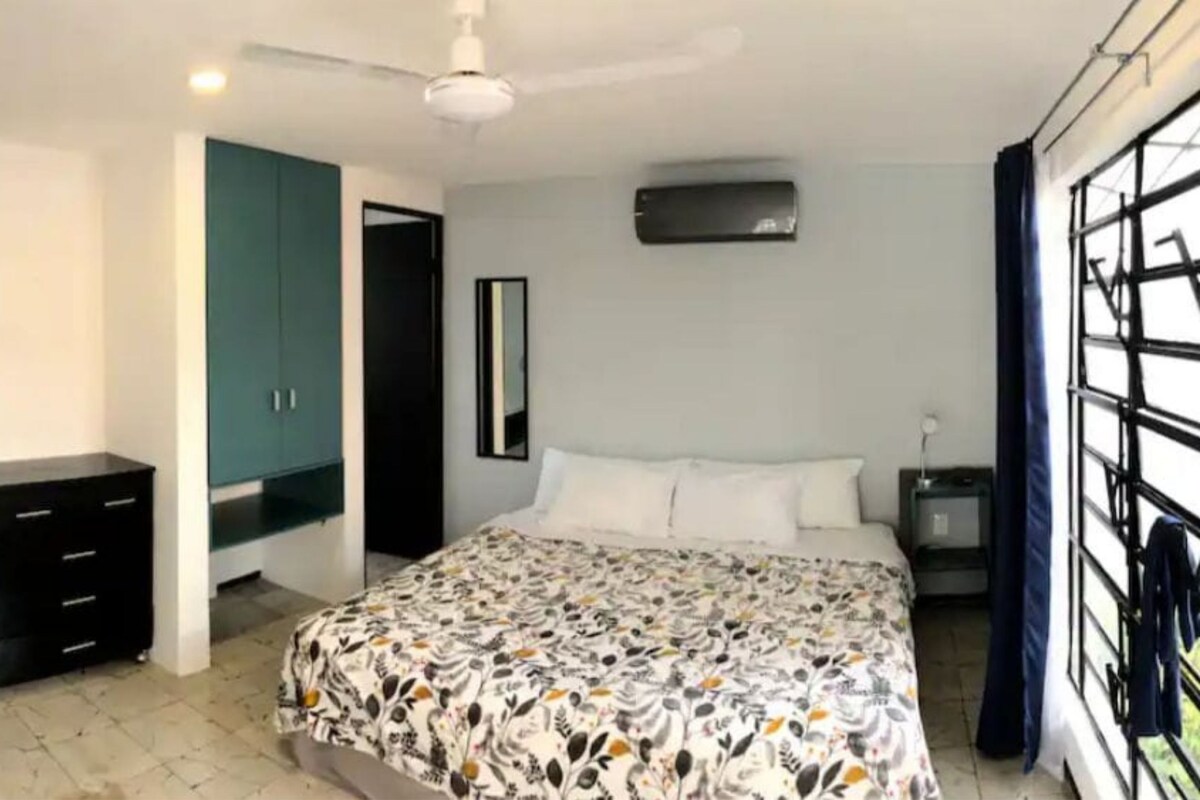 Comfort Room | Down comforters, desk, laptop workspace, blackout drapes