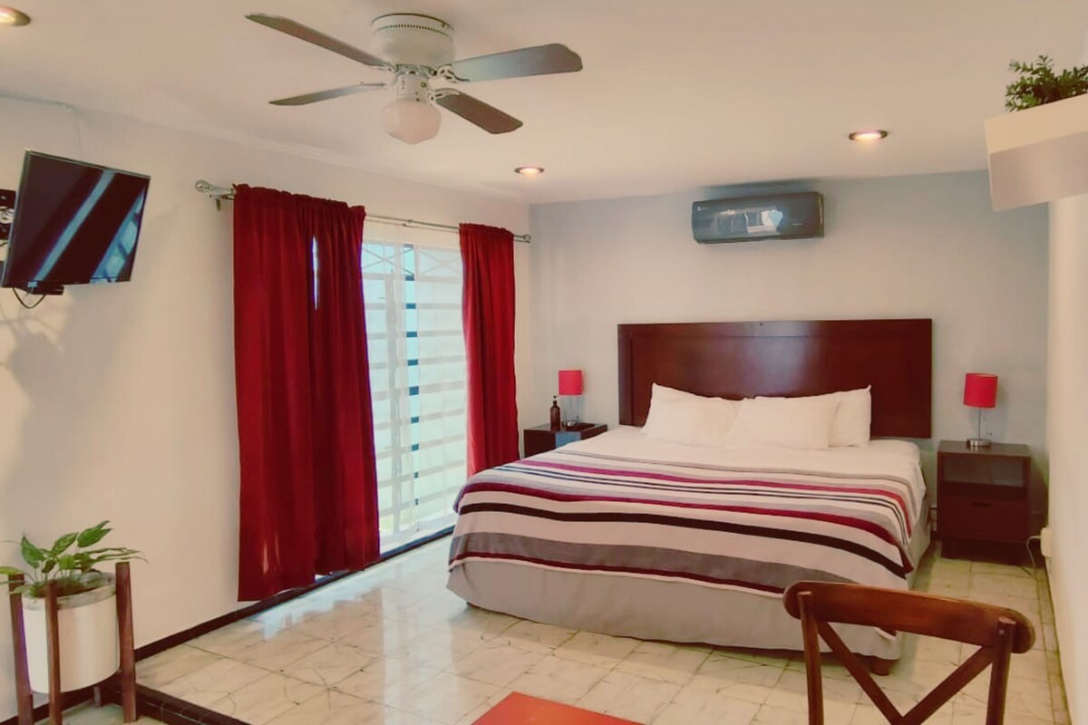 Junior Room | Down comforters, desk, laptop workspace, blackout drapes