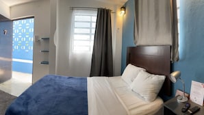 Economy Single Room | Down comforters, desk, laptop workspace, blackout drapes - Suites del Sureste (Mérida)