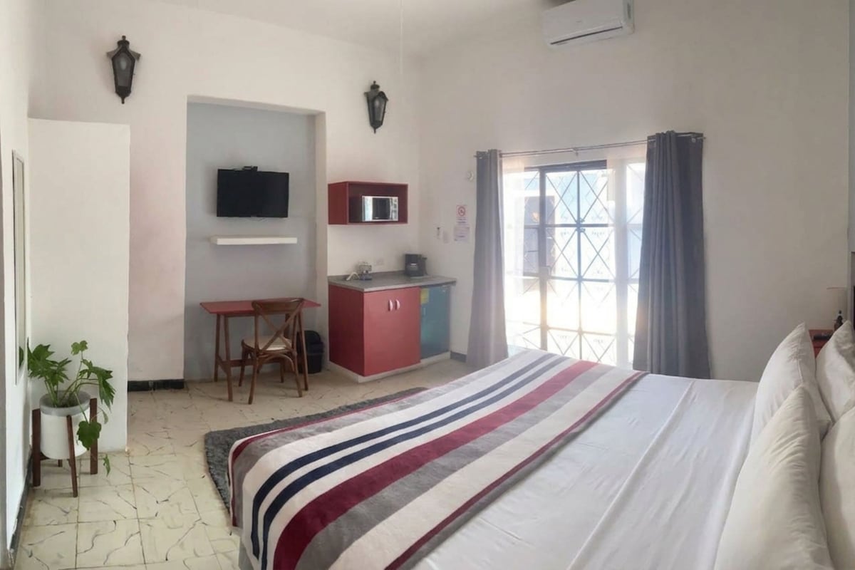 Basic Room | Down comforters, desk, laptop workspace, blackout drapes
