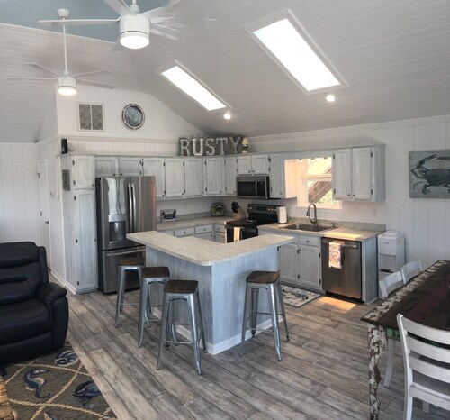 4X4 only! Canal front. Ocean AND sound views! Decks and porches on all levels.