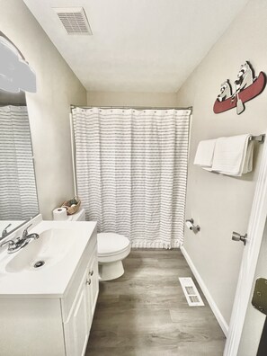 Combined shower/tub, hair dryer, towels, soap