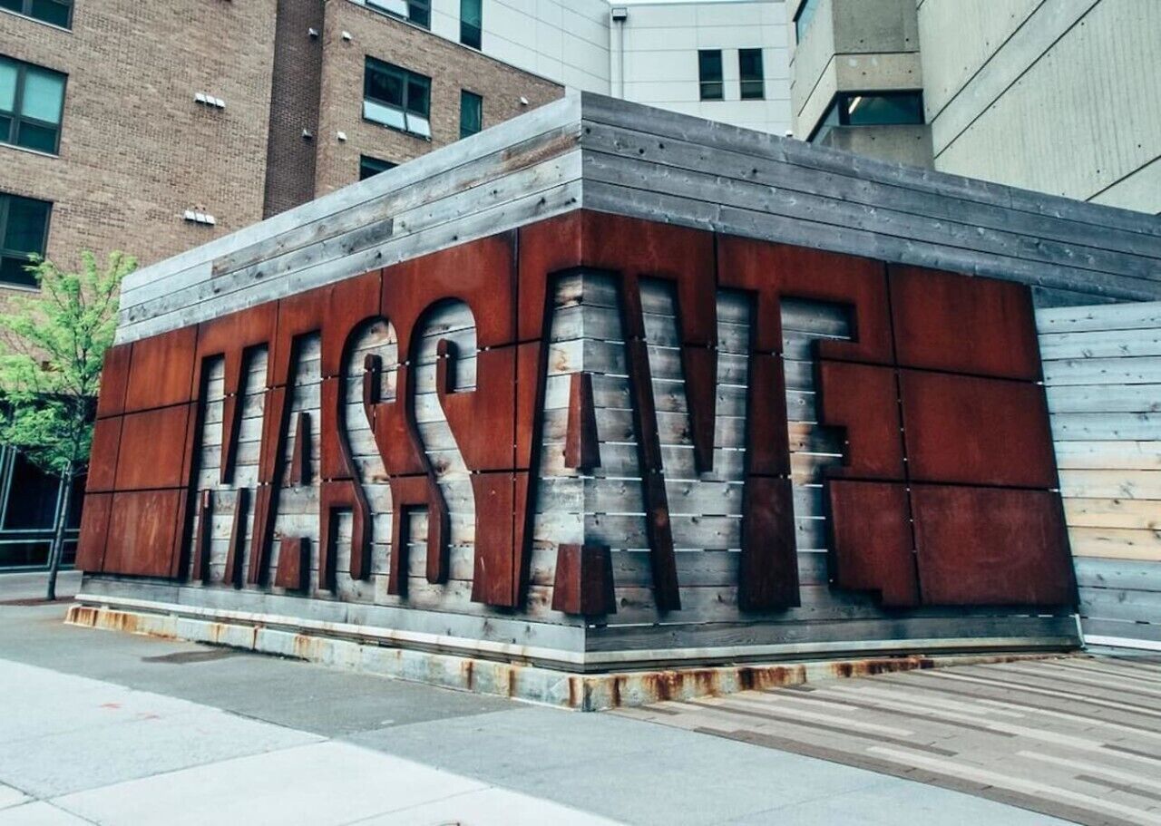 A large, rectangular metal structure with the words 'MASSIVE' prominently displayed.