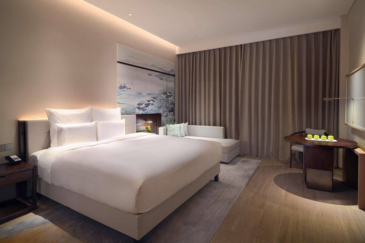 Premium bedding, down comforters, pillowtop beds, minibar