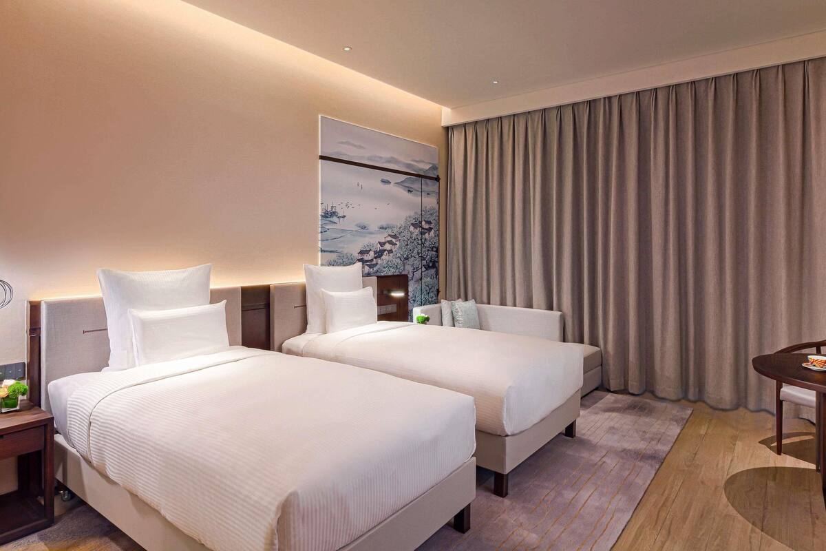 Premium bedding, down comforters, pillowtop beds, minibar