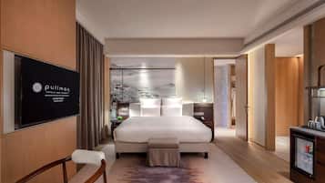 Premium bedding, down comforters, pillowtop beds, minibar