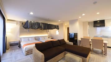 Suíte (B) | Área de estar | TV de tela plana