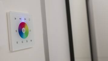 A control panel with color temperature settings labeled RGBW.