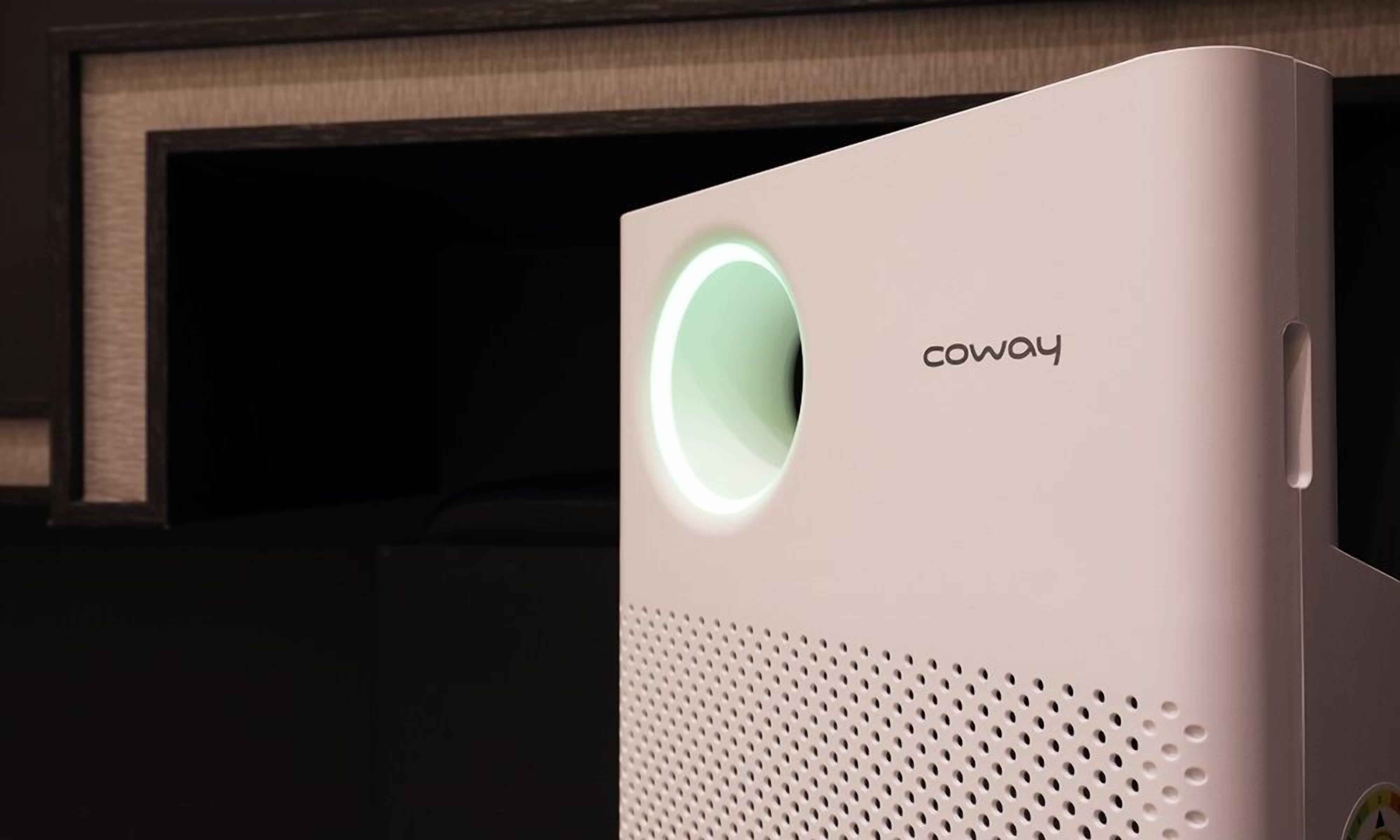 Un altavoz blanco con el nombre de marca 'coway' y una luz circular en la parte frontal.